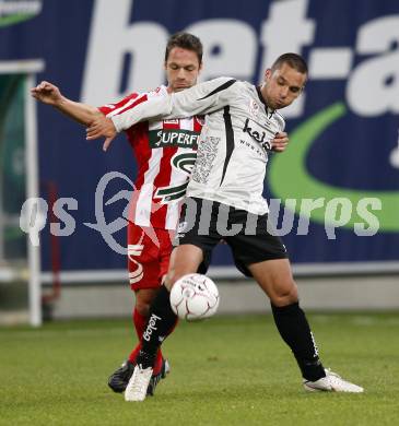 Fussball. Tipp3-Bundesliga. SK Austria Kelag Kaernten gegen SV Superfund Kapfenberg. Andre Schembri, (Austria Kaernten) Andreas Rauscher  (Kapfenberg). Klagenfurt, 24.10.2009.
Foto: Kuess  

---
pressefotos, pressefotografie, kuess, qs, qspictures, sport, bild, bilder, bilddatenbank