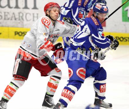 EBEL. Eishockey Bundesliga. EC Rekord Fenster VSV gegen HK Acroni Jesenice. Marco Pewal,  (VSV), Antti Pusa (Jesenice). Villach, am 3.2.2012.
Foto: Kuess 


---
pressefotos, pressefotografie, kuess, qs, qspictures, sport, bild, bilder, bilddatenbank
