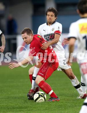 Fussball. Regionalliga.  VSV gegen St. Florian. Michael Kirisits,  (VSV), Thomas Zemann (St. Florian). Villach, 5.4.2012. 
Foto: Kuess

---
pressefotos, pressefotografie, kuess, qs, qspictures, sport, bild, bilder, bilddatenbank