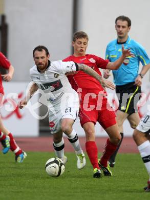 Fussball. Regionalliga.  VSV gegen St. Florian. Rok Pavlicic, (VSV), Ewald Huber  (St. Florian). Villach, 5.4.2012. 
Foto: Kuess

---
pressefotos, pressefotografie, kuess, qs, qspictures, sport, bild, bilder, bilddatenbank