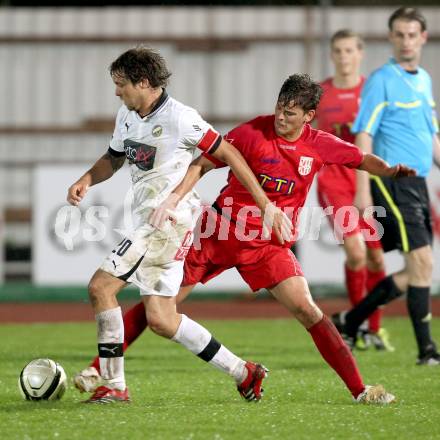 Fussball. Regionalliga.  VSV gegen St. Florian. Michael Kirisits,  (VSV), Max Babler (St. Florian). Villach, 5.4.2012. 
Foto: Kuess

---
pressefotos, pressefotografie, kuess, qs, qspictures, sport, bild, bilder, bilddatenbank