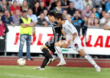 Fussball. Erste Liga.  WAC/St. Andrae gegen TSV Hartberg. Mihret Topcagic, (WAC), Robert Strobl (Hartberg). Wolfsberg, 8.5.2012. 
Foto: Kuess

---
pressefotos, pressefotografie, kuess, qs, qspictures, sport, bild, bilder, bilddatenbank