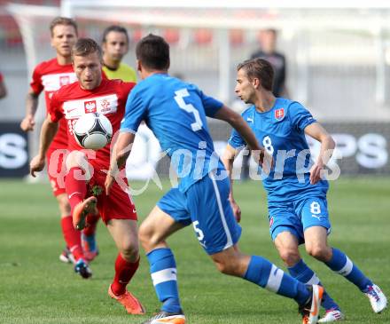 Fussball Laenderspiel. Woerthersee Stadion. Testspiel. Slowakei gegen Polen. Marek Cech, Dusan Svento,(Slowakei),  Jakub Blaszczykowski (Polen). Klagenfurt, 26.5.2012
Foto: Kuess

---
pressefotos, pressefotografie, kuess, qs, qspictures, sport, bild, bilder, bilddatenbank