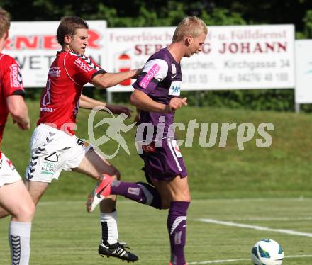 Fussball Bundesliga. Testspiel. SV Feldkirchen gegen Austria Wien. David Hebenstreit (Feldkirchen), Martin Harrer (Austria Wien). Feldkirchen, am 30.6.2012.
Foto: Kuess

---
pressefotos, pressefotografie, kuess, qs, qspictures, sport, bild, bilder, bilddatenbank