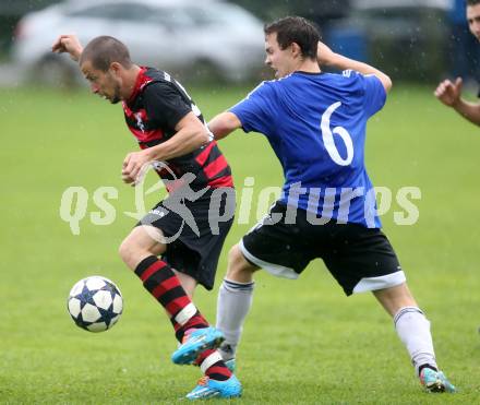 Fussball 2. KLasse D. Tainach gegen St. Paul. Kevin Marketz, (Tainach), Haci Osman Yavru  (St. Paul). Tainach, am 23.8.2014.
Foto: Kuess
---
pressefotos, pressefotografie, kuess, qs, qspictures, sport, bild, bilder, bilddatenbank