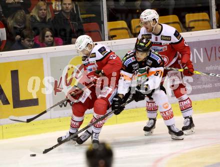 EBEL. Eishockey Bundesliga. KAC gegen 	Moser Medical Graz99ers. Jamie Lundmark,  Matthew Neal  (KAC), Daniel Woger (Graz). Klagenfurt, am 6.1.2017.
Foto: Kuess

---
pressefotos, pressefotografie, kuess, qs, qspictures, sport, bild, bilder, bilddatenbank