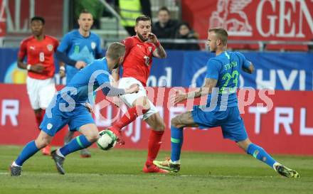 Fussball Laenderspiel. Oesterreich gegen Slowenien.Come together. Sport baut Bruecken.  Guido Burgstaller,  (Oesterreich), Aljaz Struna (Slowienien). Klagenfurt, am 23.3.2018.
Foto: Kuess

---
pressefotos, pressefotografie, kuess, qs, qspictures, sport, bild, bilder, bilddatenbank