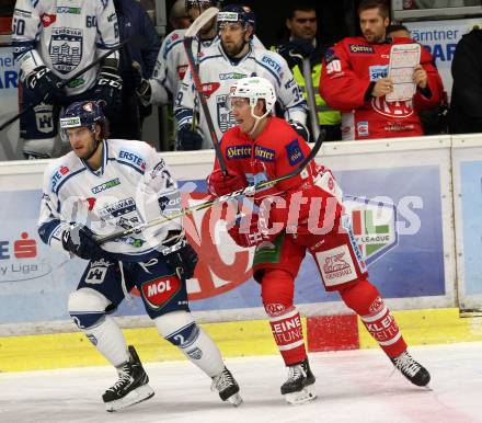 EBEL. Eishockey Bundesliga. KAC gegen Fehervar AV 19. Nicholas Eric Petersen,  (KAC), Michael Caruso (Alba Volan). Klagenfurt, am 28.10.2018.
Foto: Kuess

---
pressefotos, pressefotografie, kuess, qs, qspictures, sport, bild, bilder, bilddatenbank