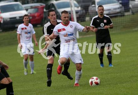 Fussball. Kaerntner Liga. Maria Saal gegen Dellach/Gail. Zoran Jorgic (Maria Saal),  Mario Niescher (Dellach). Maria Saal, 24.8.2019.
Foto: Kuess
www.qspictures.net
---
pressefotos, pressefotografie, kuess, qs, qspictures, sport, bild, bilder, bilddatenbank