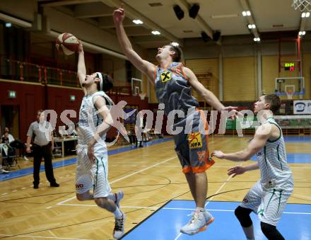 Basketball Zweite Liga 2019/2020. Grunddurchgang 15. Runde. KOS Celovec gegen  Fuerstenfeld Panthers. Volkan Oezdemir,  (KOS Celovec),  Krzysztof Kawalek (Fuerstenfeld). Klagenfurt, am 21.12.2019.
Foto: Kuess
www.qspictures.net

---
pressefotos, pressefotografie, kuess, qs, qspictures, sport, bild, bilder, bilddatenbank