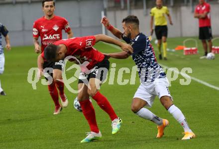 Fussball OEFB Cup. SK Austria KLagenfurt gegen Stadl-Paura. Okan Aydin,  (Klagenfurt), Miroslav Cirkovic (Stadl-Paura). KLagenfurt, am 28.8.2020.
Foto: Kuess
---
pressefotos, pressefotografie, kuess, qs, qspictures, sport, bild, bilder, bilddatenbank