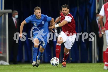 Fussball Laenderspiel. Oesterreich gegen Griechenland. Aleksandar Dragovic, (Oesterreich), Kostas Fortounis  (Griechenland). Klagenfurt Woerthersee Stadion, am 7.10.2020.
Foto: Kuess
www.qspictures.net
---
pressefotos, pressefotografie, kuess, qs, qspictures, sport, bild, bilder, bilddatenbank