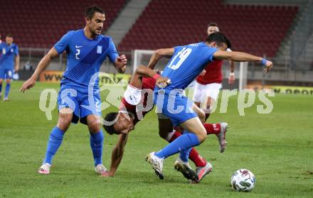 Fussball Laenderspiel. Oesterreich gegen Griechenland. Karim Onisiwo,  (Oesterreich), Vasileios Lambropoulos, Efstratios Svarnas (Griechenland). Klagenfurt Woerthersee Stadion, am 7.10.2020.
Foto: Kuess
www.qspictures.net
---
pressefotos, pressefotografie, kuess, qs, qspictures, sport, bild, bilder, bilddatenbank