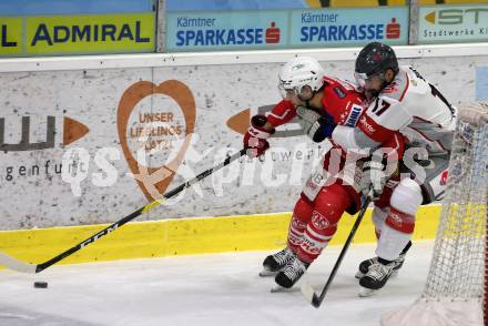 EBEL. Eishockey Bundesliga. KAC gegen	Bratislava Capitals. Lukas Haudum,  (KAC), David Buc (Bratislava). Klagenfurt, am 10.1.2021.
Foto: Kuess
www.qspictures.net

---
pressefotos, pressefotografie, kuess, qs, qspictures, sport, bild, bilder, bilddatenbank