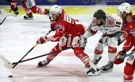 EBEL. Eishockey Bundesliga. KAC gegen	Bratislava Capitals. Lukas Haudum,  (KAC), Denis Hudec (Bratislava). Klagenfurt, am 10.1.2021.
Foto: Kuess
www.qspictures.net

---
pressefotos, pressefotografie, kuess, qs, qspictures, sport, bild, bilder, bilddatenbank