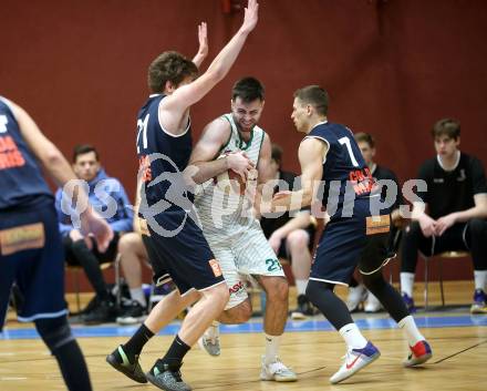Basketball Zweite Liga 2020/2021. Grunddurchgang 16. Runde. KOS Celovec gegen BBC Nord Dragonz. Marin Sliskovic (KOS Celovec), Lukas Knor , Dragisa Najdanovic  (BBC Nord Dragonz). Klagenfurt, am 16.1.2021.
Foto: Kuess
www.qspictures.net

---
pressefotos, pressefotografie, kuess, qs, qspictures, sport, bild, bilder, bilddatenbank