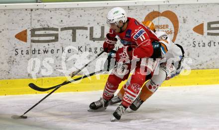 EBEL. Eishockey Bundesliga. KAC gegen	Black Wings 1992 Linz. Lukas Haudum,  (KAC), Charles David Beaudoin (Linz). Klagenfurt, am 24.1.2021.
Foto: Kuess
www.qspictures.net

---
pressefotos, pressefotografie, kuess, qs, qspictures, sport, bild, bilder, bilddatenbank