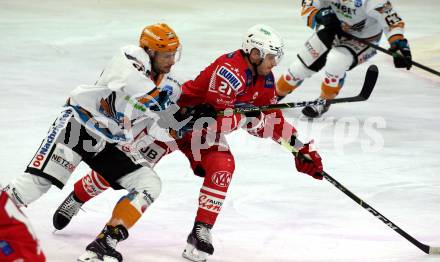 EBEL. Eishockey Bundesliga. KAC gegen	Black Wings 1992 Linz. Manuel Geier,  (KAC), Julian Pusnik (Linz). Klagenfurt, am 24.1.2021.
Foto: Kuess
www.qspictures.net

---
pressefotos, pressefotografie, kuess, qs, qspictures, sport, bild, bilder, bilddatenbank