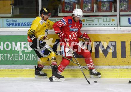 EBEL. Eishockey Bundesliga. KAC gegen	spusu Vienna Capitals. Hundertpfund Thomas (KAC), Fischer Mario (Vienna Capitals). Klagenfurt, am 14.2.2021.
Foto: Kuess
www.qspictures.net

---
pressefotos, pressefotografie, kuess, qs, qspictures, sport, bild, bilder, bilddatenbank