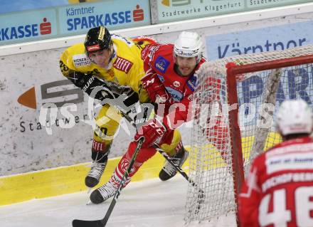 EBEL. Eishockey Bundesliga. KAC gegen	spusu Vienna Capitals. Hundertpfund Thomas (KAC), Johnson Steve (Vienna Capitals). Klagenfurt, am 14.2.2021.
Foto: Kuess
www.qspictures.net

---
pressefotos, pressefotografie, kuess, qs, qspictures, sport, bild, bilder, bilddatenbank