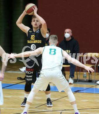 Basketball Zweite Liga 2020/2021. Grunddurchgang 22. Runde. KOS Celovec gegen  Guessing/Jennersdorf Blackbirds. Jernej Andolsek Heine,  (KOS Celovec), Mate Horvath (Blackbirds). Klagenfurt, am 13.3.2021.
Foto: Kuess
www.qspictures.net

---
pressefotos, pressefotografie, kuess, qs, qspictures, sport, bild, bilder, bilddatenbank