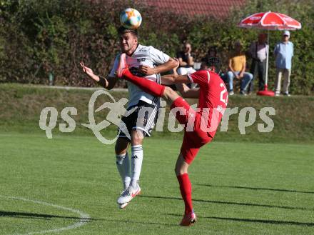 Fussball. Kaerntner Liga. Ferlach Atus gegen St. Michael/Bl.. Stephan Buergler  (Ferlach),  Philipp Gerhard Pachoinig (St. Michael). Ferlach, am 25.9.2021.
Foto: Kuess
www.qspictures.net
---
pressefotos, pressefotografie, kuess, qs, qspictures, sport, bild, bilder, bilddatenbank