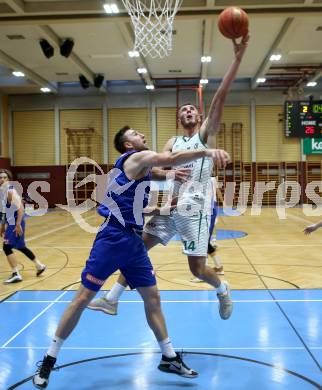 Basketball Austria Cup 2021/22.  KOS Celovec gegen  Vienna D.C. Timberwolves. Marko Gutalj (KOS), Nemanja Nikolic (Timberwolves). Klagenfurt, am 24.10.2021.
Foto: Kuess
www.qspictures.net
---
pressefotos, pressefotografie, kuess, qs, qspictures, sport, bild, bilder, bilddatenbank