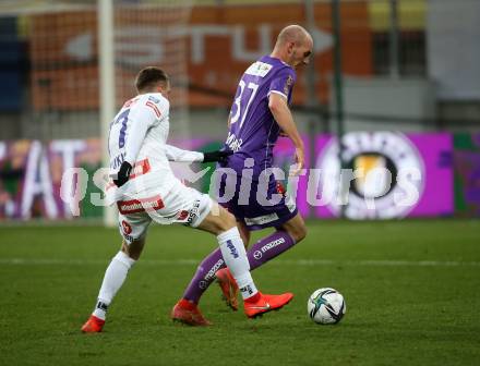 Fussball. Bundesliga. SK Austria Klagenfurt gegen  FK Austria Wien.    Nicolas Wimmer (Klagenfurt),  Aleksandar Jukic (Wien). Klagenfurt, am 21.11.2021.
Foto: Kuess
www.qspictures.net
---
pressefotos, pressefotografie, kuess, qs, qspictures, sport, bild, bilder, bilddatenbank