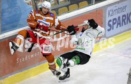 EBEL. Eishockey Bundesliga. KAC gegen	HK SZ Olimpija. Manuel Ganahl,  (KAC), Aleksandar Magovac  (Olimpija). Klagenfurt, am 7.12.2021.
Foto: Kuess
www.qspictures.net

---
pressefotos, pressefotografie, kuess, qs, qspictures, sport, bild, bilder, bilddatenbank