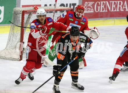 EBEL. Eishockey Bundesliga. KAC gegen	Moser Medical Graz99ers. Thomas Vallant, Sebastian Dahm,  (KAC),  Zintis Nauris Zusevics (Graz). Klagenfurt, am 6.1.2022.
Foto: Kuess
www.qspictures.net

---
pressefotos, pressefotografie, kuess, qs, qspictures, sport, bild, bilder, bilddatenbank