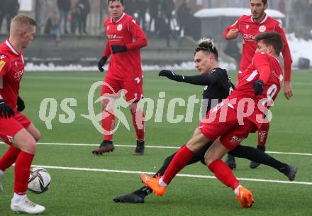 Fussball Testspiel. SK Austria Klagenfurt gegen SV Spittal. Lukas Fridrikas,  (Klagenfurt),  Michael Oberwinkler (Spittal). Moosburg, am 15.1.2022.
Foto: Kuess
www.qspictures.net
---
pressefotos, pressefotografie, kuess, qs, qspictures, sport, bild, bilder, bilddatenbank