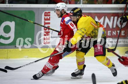 EBEL. Eishockey Bundesliga. KAC gegen	spusu Vienna Capitals. Lukas Haudum,  (KAC), Alex Wall  (Vienna Capitals). Klagenfurt, am 20.3.2022.
Foto: Kuess
www.qspictures.net

---
pressefotos, pressefotografie, kuess, qs, qspictures, sport, bild, bilder, bilddatenbank