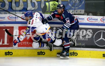 EBEL. Eishockey Bundesliga. VSV gegen Hydro Fehervar AV 19.  Derek Joslin, (VSV), Istvan Terbocs   (Hydro Fehervar). Villach, am 1.4.2022.
Foto: Kuess
www.qspictures.net
---
pressefotos, pressefotografie, kuess, qs, qspictures, sport, bild, bilder, bilddatenbank
