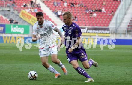 Fussball Bundesliga. Play-off. SK Austria Klagenfurt gegen FK Austria Wien.  Florian Jaritz, (Klagenfurt),  Can Keles (Wien). Klagenfurt, am 15.5.2022.
Foto: Kuess
www.qspictures.net
---
pressefotos, pressefotografie, kuess, qs, qspictures, sport, bild, bilder, bilddatenbank