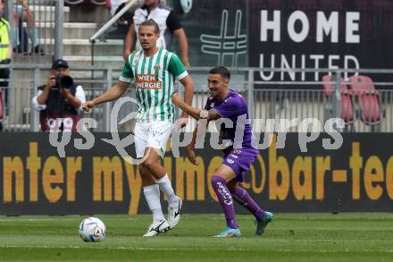 Fussball. Bundesliga. Austria Klagenfurt gegen Rapid Wien. Sinan Karweina (Klagenfurt),  Patrick Greil (Rapid).  Klagenfurt, 31.7.2022.
Foto: Kuess
---
pressefotos, pressefotografie, kuess, qs, qspictures, sport, bild, bilder, bilddatenbank