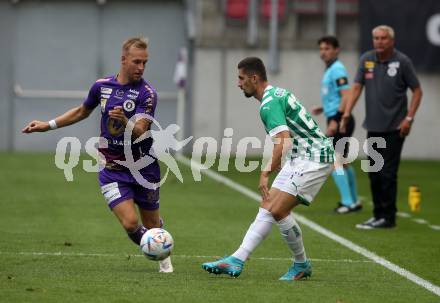 Fussball. Bundesliga. Austria Klagenfurt gegen Rapid Wien. Florian Jaritz (Klagenfurt),  Martin Koscelnik (Rapid).  Klagenfurt, 31.7.2022.
Foto: Kuess
---
pressefotos, pressefotografie, kuess, qs, qspictures, sport, bild, bilder, bilddatenbank