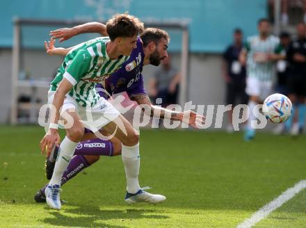 Fussball. Bundesliga. Austria Klagenfurt gegen Rapid Wien. Kosmas Gkezos,  (Klagenfurt),   Nikolas Sattlberger (Rapid).  Klagenfurt, 31.7.2022.
Foto: Kuess
---
pressefotos, pressefotografie, kuess, qs, qspictures, sport, bild, bilder, bilddatenbank