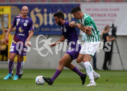 Fussball. Bundesliga. Austria Klagenfurt gegen Rapid Wien. Kosmas Gkezos,  (Klagenfurt),  Rene Kriwak (Rapid).  Klagenfurt, 31.7.2022.
Foto: Kuess
---
pressefotos, pressefotografie, kuess, qs, qspictures, sport, bild, bilder, bilddatenbank