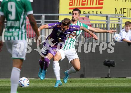 Fussball. Bundesliga. Austria Klagenfurt gegen Rapid Wien. Florian Rieder (Klagenfurt),  Martin Koscelnik (Rapid).  Klagenfurt, 31.7.2022.
Foto: Kuess
---
pressefotos, pressefotografie, kuess, qs, qspictures, sport, bild, bilder, bilddatenbank