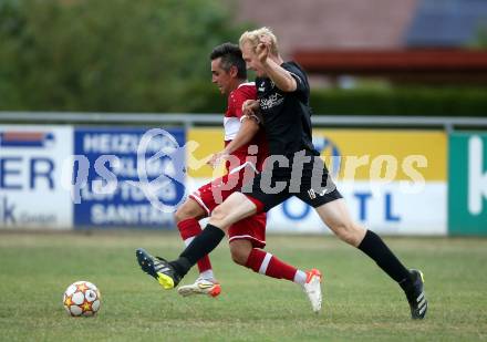 Fussball 2. Klasse C. St. Margarethen im Lavanttal gegen St. Paul.  Jakob Peter Schmeisser (St.Margarethen),  Aljosa Gluhovic  (St. Paul).  St. Matgarethen, am 6.8.2022.
Foto: Kuess
---
pressefotos, pressefotografie, kuess, qs, qspictures, sport, bild, bilder, bilddatenbank