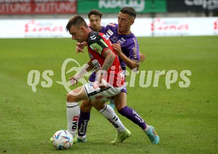 Fussball Bundesliga.  SK Austria Klagenfurt gegen SV Guntamatic Ried. Sinan Karweina, (Klagenfurt),  Philipp Pomer   (Ried). Klagenfurt, am 13.8.2022. 
Foto: Kuess

---
pressefotos, pressefotografie, kuess, qs, qspictures, sport, bild, bilder, bilddatenbank