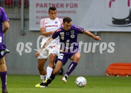 Fussball Bundesliga.  SK Austria Klagenfurt gegen FK Austria Wien.  Andrew Irving,  (Klagenfurt),   Manfred Fischer  (Wien). Klagenfurt, am 28.8.2022. 
Foto: Kuess

---
pressefotos, pressefotografie, kuess, qs, qspictures, sport, bild, bilder, bilddatenbank