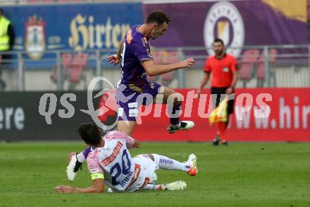 Fussball Bundesliga.  SK Austria Klagenfurt gegen FK Austria Wien.   Andrew Irving,  (Klagenfurt),   Lukas Muehl (Wien). Klagenfurt, am 28.8.2022. 
Foto: Kuess

---
pressefotos, pressefotografie, kuess, qs, qspictures, sport, bild, bilder, bilddatenbank