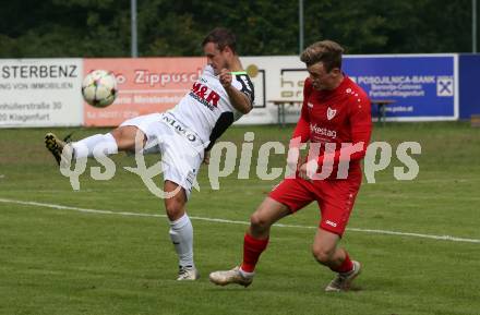 Fussball. Kaerntner Liga. Atus Ferlach gegen SV Feldkirchen.  Hannes Marcel Schwarz  (Ferlach),   Michael Tammegger (Feldkirchen). Ferlach, 24.9.2022.
Foto: Kuess
---
pressefotos, pressefotografie, kuess, qs, qspictures, sport, bild, bilder, bilddatenbank