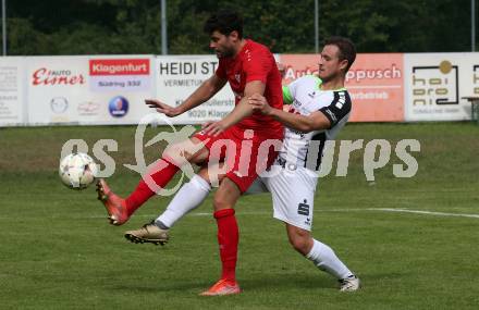 Fussball. Kaerntner Liga. Atus Ferlach gegen SV Feldkirchen.  Stephan BÃ¼rgler   (Ferlach),    Michael Tammegger (Feldkirchen). Ferlach, 24.9.2022.
Foto: Kuess
---
pressefotos, pressefotografie, kuess, qs, qspictures, sport, bild, bilder, bilddatenbank