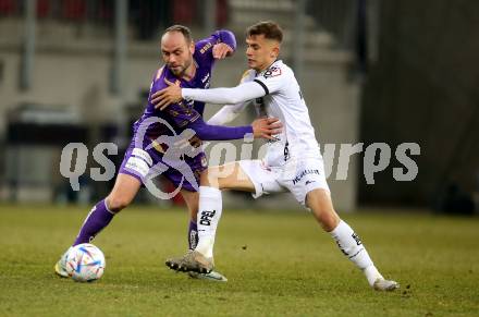 Fussball Bundesliga. SK Austria Klagenfurt gegen RZ Pellets WAC. Rico Benatelli,   (Klagenfurt),   Ervin Omic (WAC). Klagenfurt, am 18.2.2023.
Foto: Kuess
---
pressefotos, pressefotografie, kuess, qs, qspictures, sport, bild, bilder, bilddatenbank