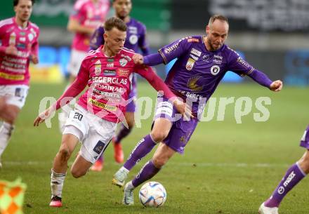 Fussball Bundesliga. SK Austria Klagenfurt gegen TSV Hartberg. Rico Benatelli,   (Klagenfurt),  Manuel Pfeifer  (Hartberg).  Klagenfurt, am 12.3.2023.
Foto: Kuess
---
pressefotos, pressefotografie, kuess, qs, qspictures, sport, bild, bilder, bilddatenbank