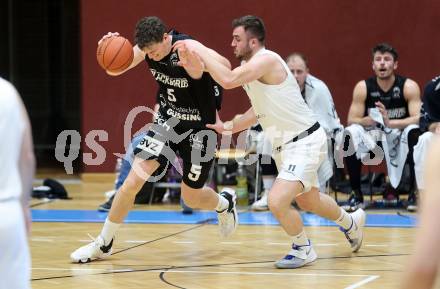 Basketball 2. Liga 2022/2023. Playoff.  2. Runde. KOS Celovec gegen Guessing Blackbirds.   Andi Shehu (KOS),  Sebastian Koch (Guessing). Klagenfurt, am 19.3.2023.
Foto: Kuess
www.qspictures.net
---
pressefotos, pressefotografie, kuess, qs, qspictures, sport, bild, bilder, bilddatenbank