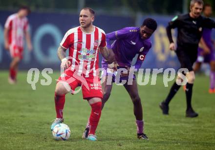 Fussball Kaerntner Liga. KAC gegen Austria Klagenfurt Amat.   Andreas Bernhard Schritliser (KAC),   Mersei Dieu Nsandi  (Austria Klagenfurt). Klagenfurt, 12.5.2023.
Foto: Kuess


---
pressefotos, pressefotografie, kuess, qs, qspictures, sport, bild, bilder, bilddatenbank