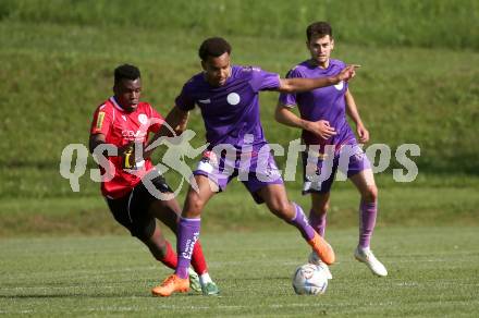 Fussball Kaerntner Liga. SK Austria Klagenfurt gegen Spittal.  Emilian Metu (Austria Klagenfurt),  Rashidi Mohamed Udikaluka (Spittal). Brueckl, am 27.5.2023.
Foto: Kuess



---
pressefotos, pressefotografie, kuess, qs, qspictures, sport, bild, bilder, bilddatenbank